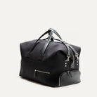 Voyagez avec classe grâce à ce sac de voyage noir en toile résistante. Il est équipé de poignées en cuir et de poches extérieures zippées pour une organisation facile. Son design épuré et fonctionnel le rend idéal pour tous vos déplacements, offrant un espace de rangement suffisant pour tous vos essentiels de voyage.